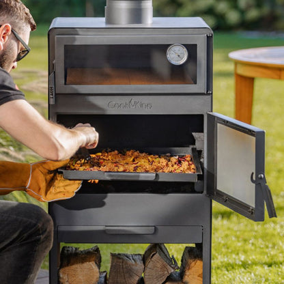 Gartenofen Vento mit Backofen + Rohstahlrost und Holzregal 120×40×30 cm – Zubereitung mit ausgezogenem Grillrost
